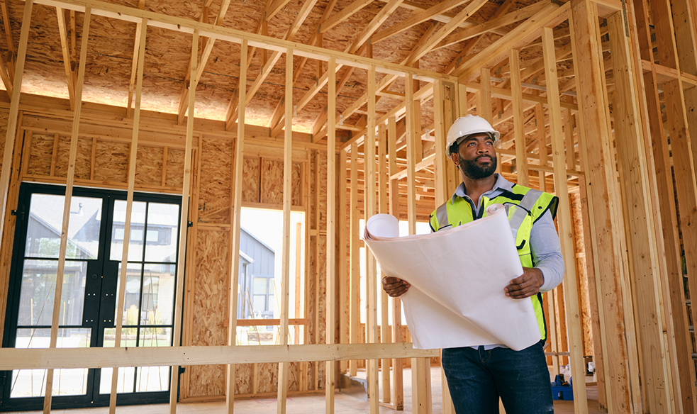 Engineer inspecting residential construction site